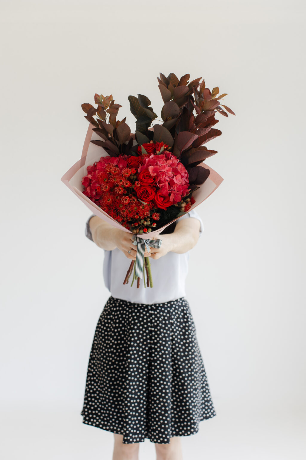 Girl holds Valentines day flowers