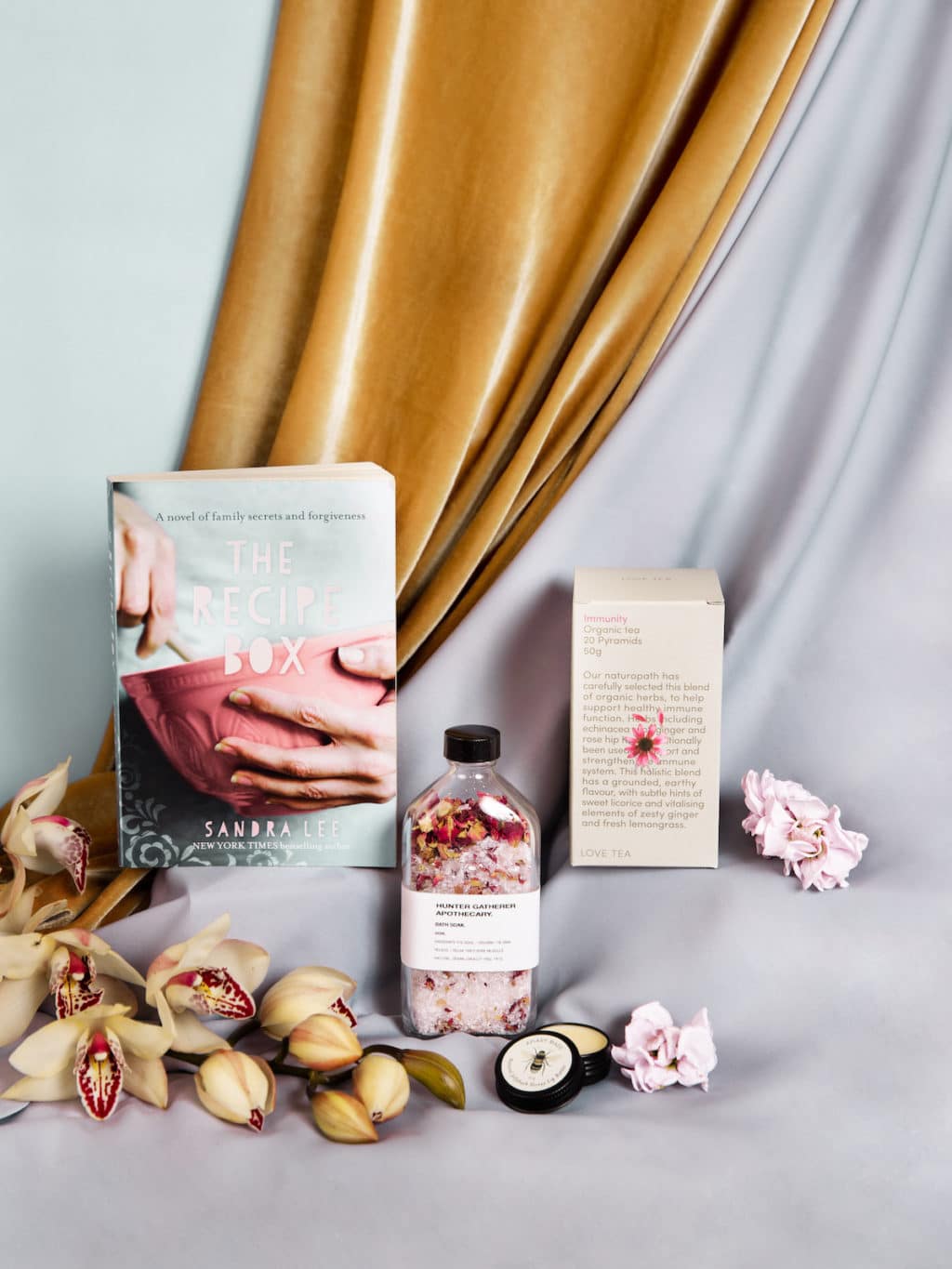 A book, tea, bath soak and lip balm from our hamper, available to add to a fresh flower delivery from our wagga Wagga florist shop.