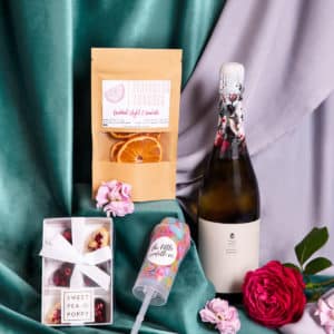Champagne, confetti, heart chocolates and cocktail oranges from our hamper, available to add to a fresh flower delivery from our Wagga Wagga florist shop.