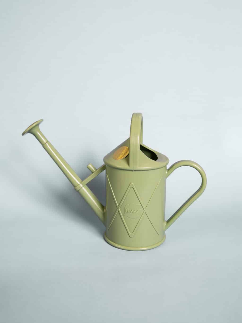 A green indoor watering can. A beautiful gift at our boutique, Wagga Wagga florist shop.